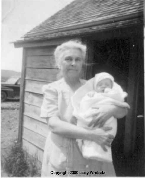 Anna Zenisek Wrobetz holding her grandchild