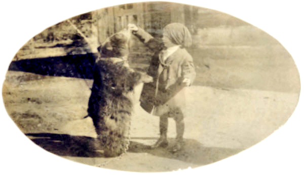 Elliott Roberts Feeding Bear at Kalispell, Flathead County, Montana ca 1905