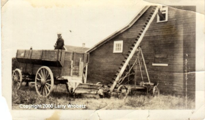 Louie Hauge Putting Hay in the Loft