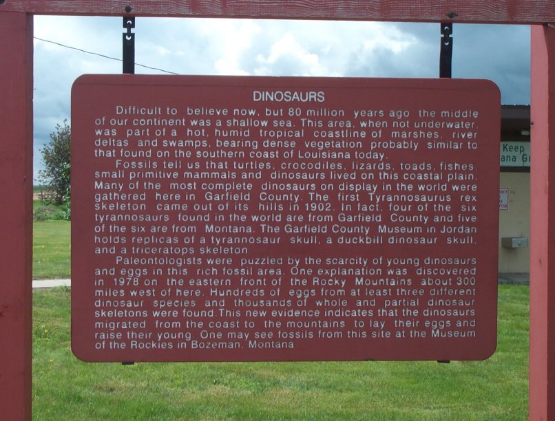 Road Sign about Dinosaurs Flowing Wells, McCone County, Montana